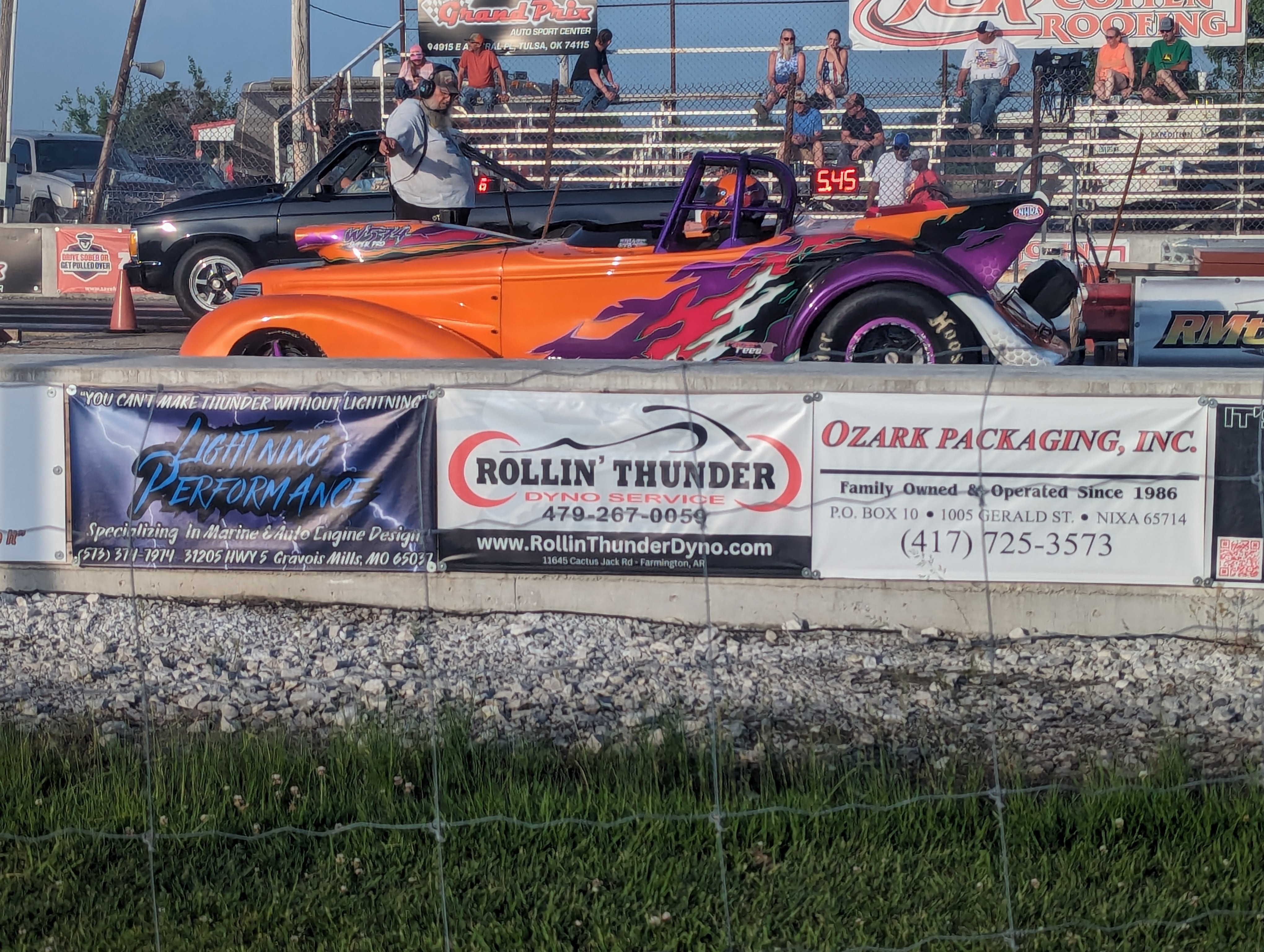 Flamed Open-Cockpit Dragster at Starting Line