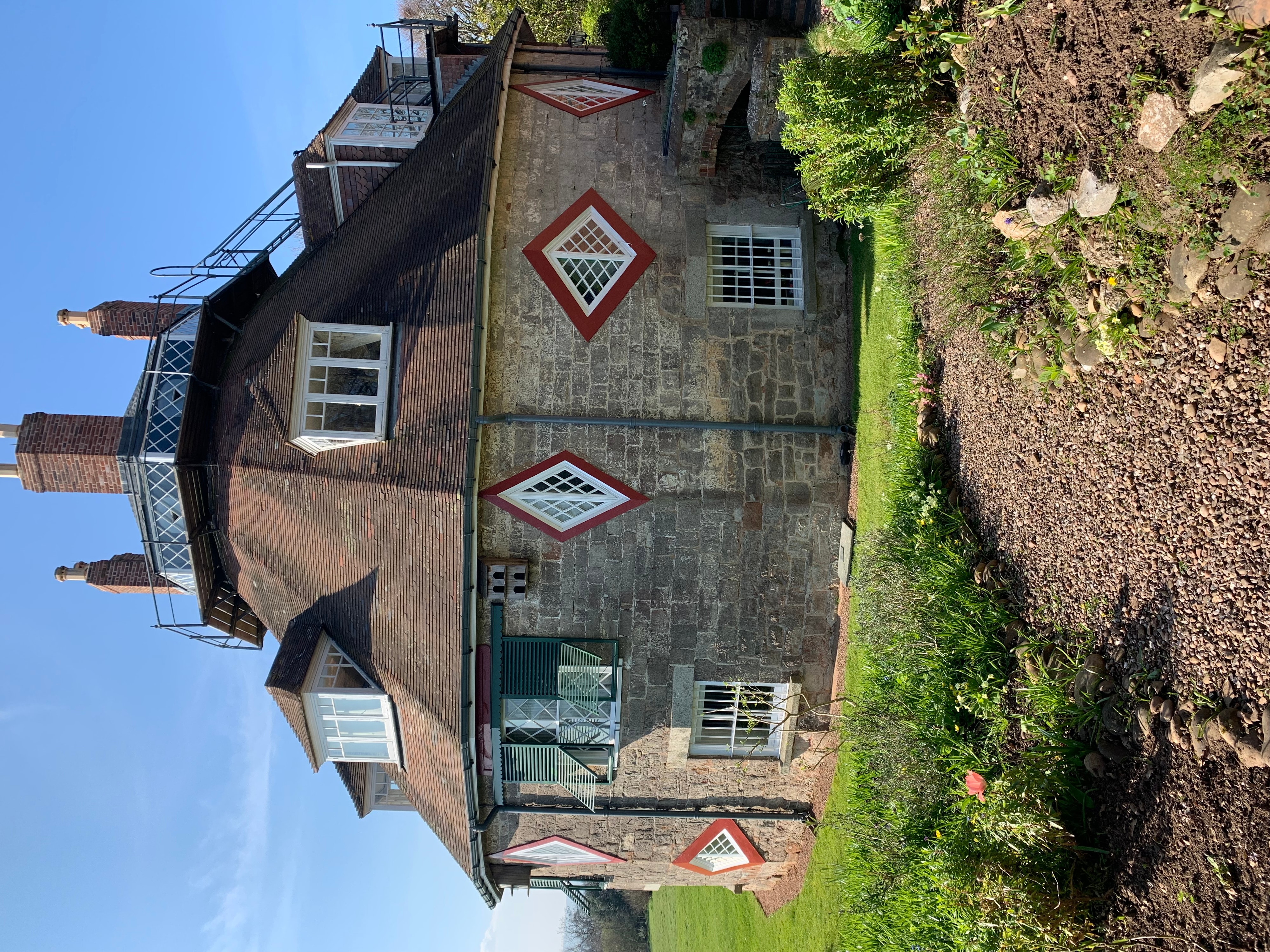 Timber-Framed House with Diamond Lattice Windows