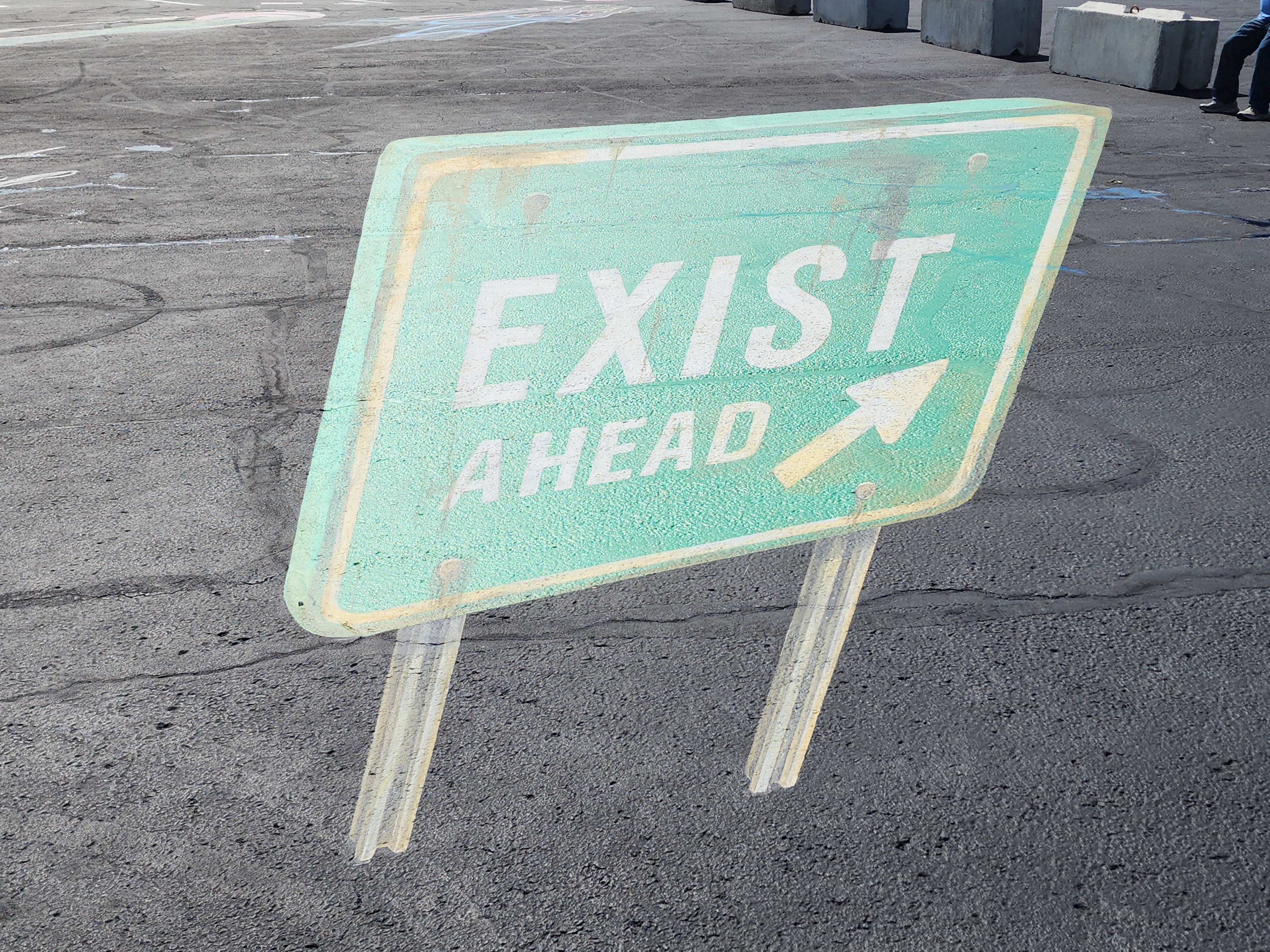 Weathered 'Exist Ahead' Sign in Joplin