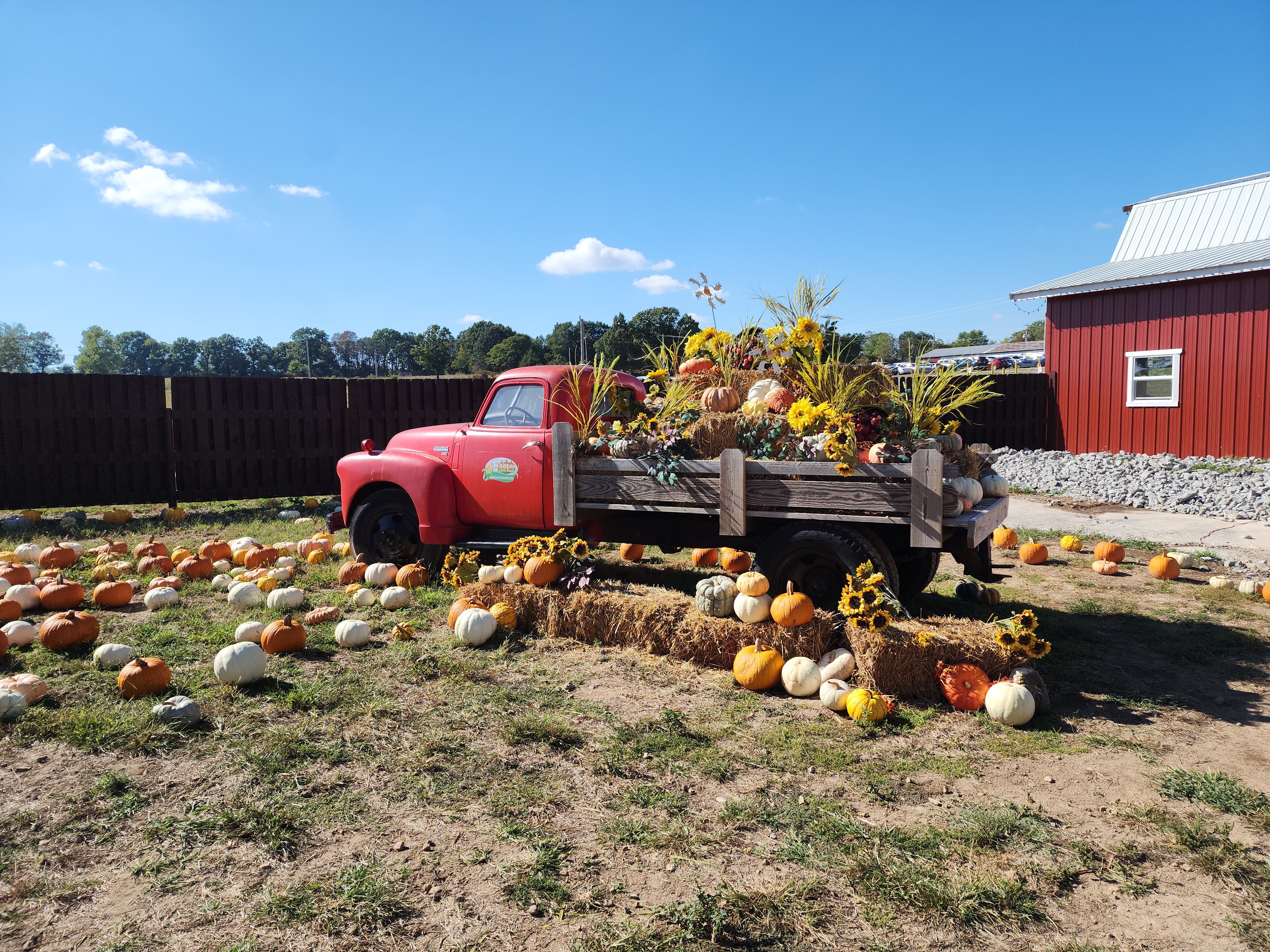 Vintage Red Farm Truck with Pumpkin Harvest Display
